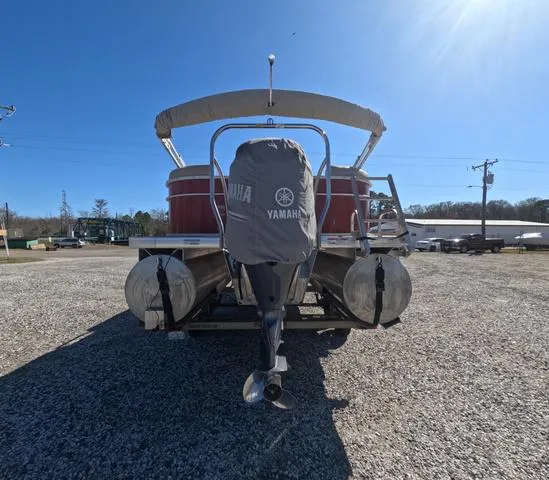 Slide: The Image of 2015 Sweetwater SW 2286 SLC pontoon boat with Yamaha engine cover, parked on gravel. - 6
