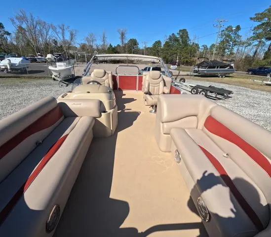 Slide: The Image of 2015 Sweetwater SW 2286 SLC pontoon boat with spacious seating and beige-red interior. - 8