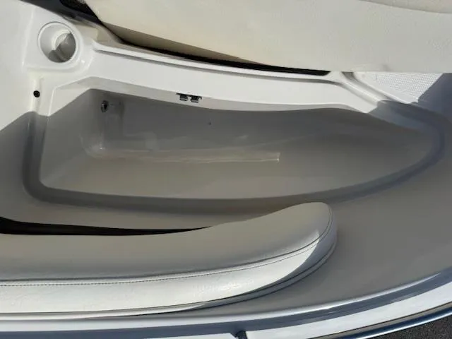 Slide: The Image of 2007 Tahoe Q7i boat interior storage compartment with white seating. - 15