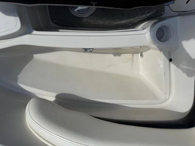 Slide: The Image of 2007 Tahoe Q7i boat interior detail with white seating and storage compartment. - 16