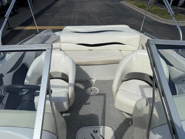 Slide: The Image of 2007 Tahoe Q7i boat interior with white seating and steering wheel. - 17