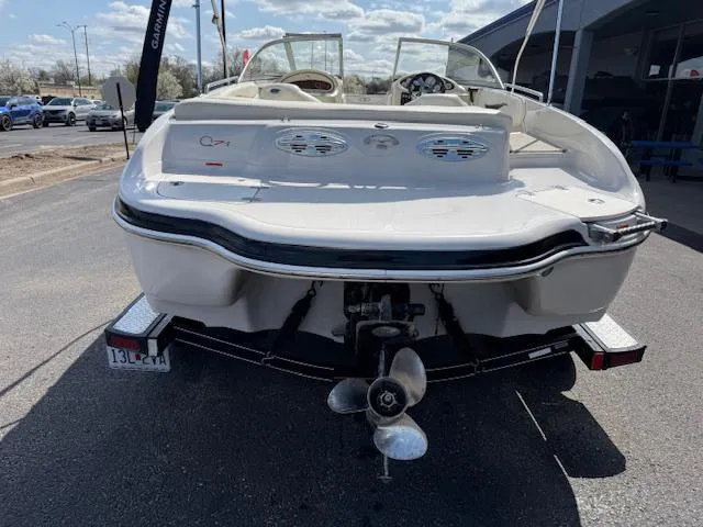Slide: The Image of 2007 Tahoe Q7i boat on trailer, rear view, parked outdoors. - 3