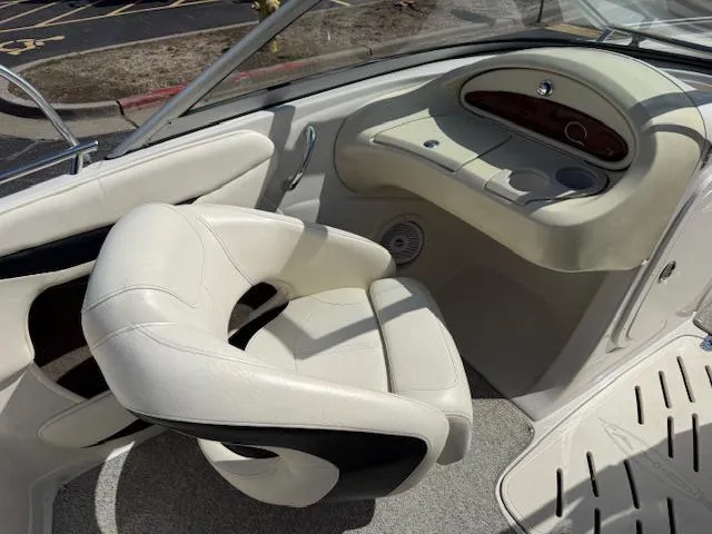 Slide: The Image of 2007 Tahoe Q7i boat interior with white seating and dashboard. - 6