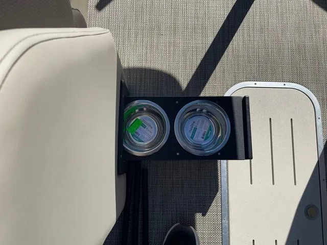 Slide: The Image of Cup holders on 2025 Bentley Pontoons 223 Legacy Swingback boat, featuring sleek interior design. - 14