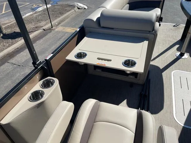 Slide: The Image of 2025 Bentley Pontoons 223 Legacy Swingback interior with cup holders and seating. - 16