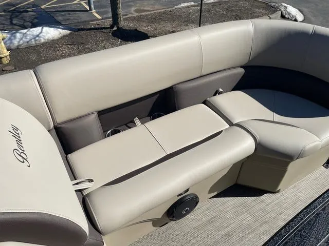 Slide: The Image of 2025 Bentley Pontoons 223 Legacy Swingback with luxurious beige seating and sleek design. - 19