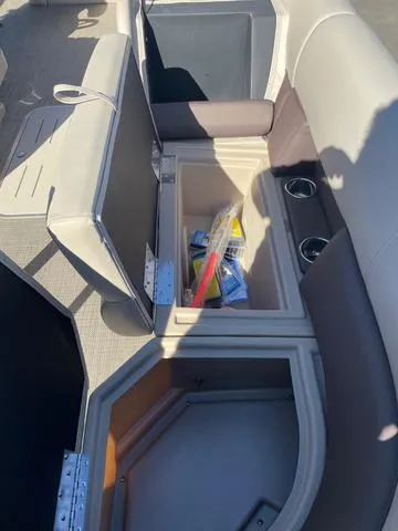 Slide: The Image of 2025 Bentley Pontoons 223 Legacy Swingback interior storage compartments with cup holders. - 20