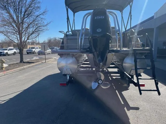 Slide: The Image of 2025 Bentley Pontoons 223 Legacy Swingback on trailer, rear view with outboard motor. - 23