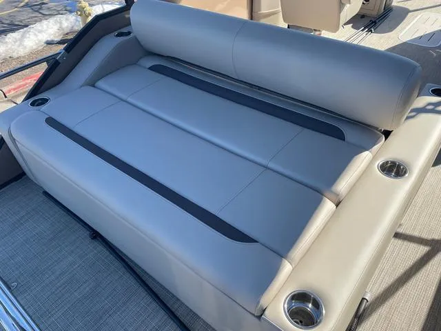 Slide: The Image of 2025 Bentley Pontoons 223 Legacy Swingback seating with cup holders, showcasing luxury and comfort. - 3
