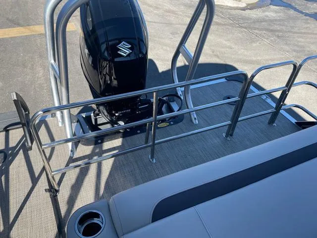Slide: The Image of 2025 Bentley Pontoons 223 Legacy Swingback with Suzuki outboard motor, rear deck view. - 4