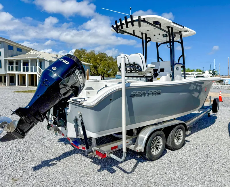 Slide: The Image of 2023 Sea Pro 219 Center Console boat on trailer, featuring Suzuki outboard motor. - 14