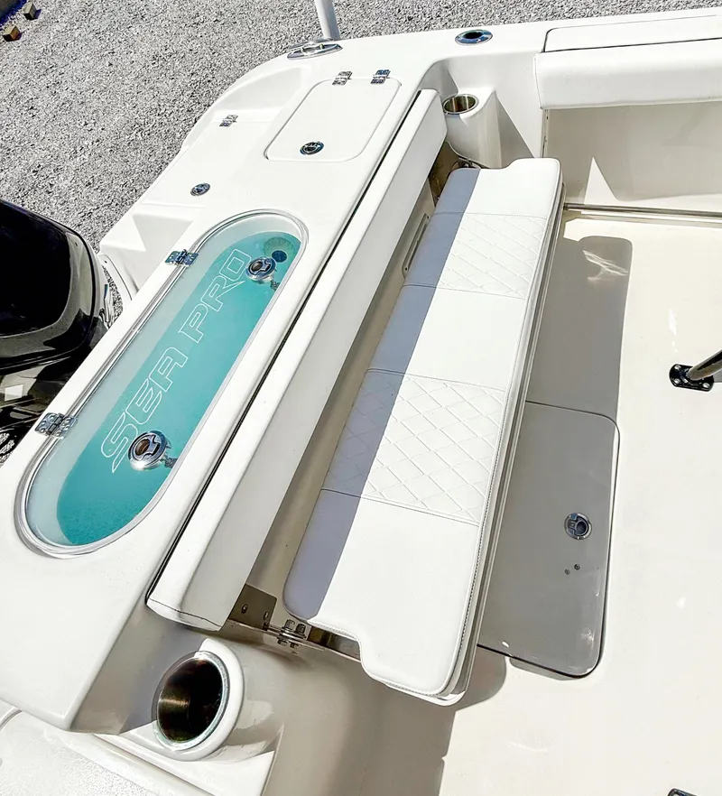 Slide: The Image of 2023 Sea Pro 219 Center Console boat interior with seating and storage. - 5