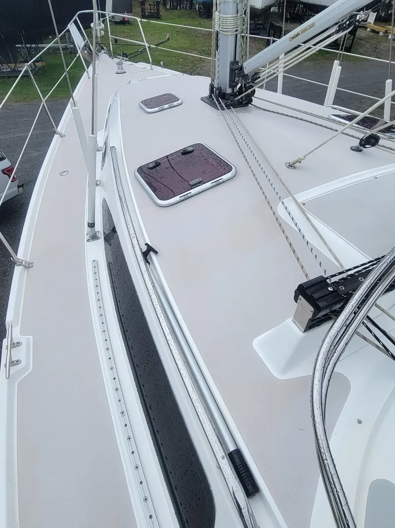 Slide: The Image of 2010 Catalina 350 sailboat deck with hatches and rigging, viewed from above. - 16