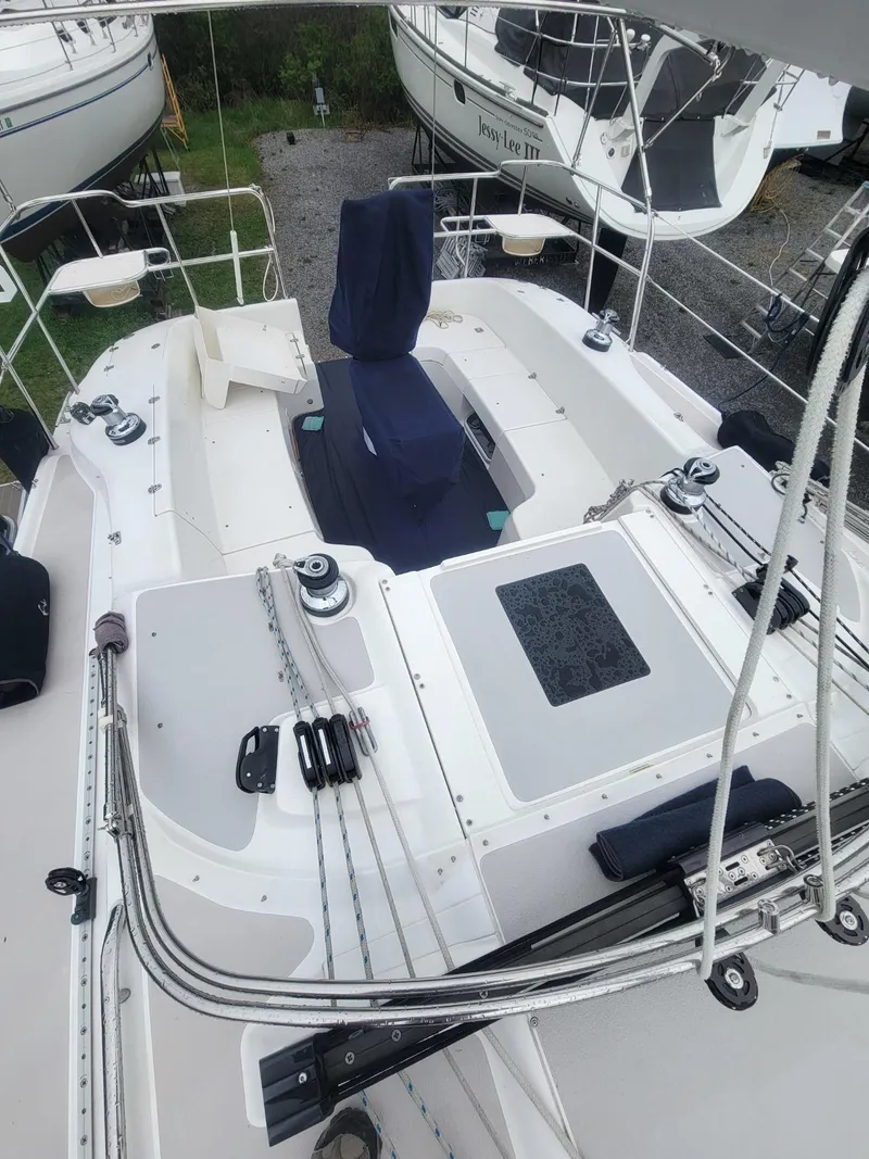 Slide: The Image of 2010 Catalina 350 sailboat cockpit with seating, winches, and rigging. - 17
