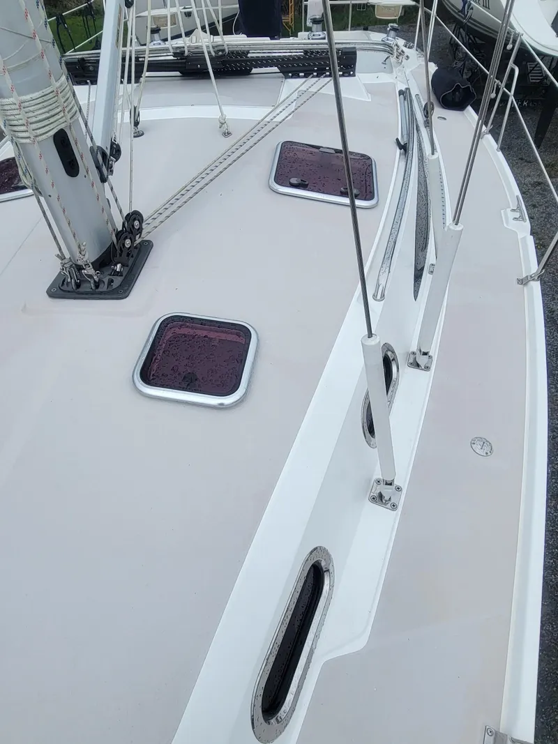 Slide: The Image of 2010 Catalina 350 sailboat deck with hatches and rigging. - 19