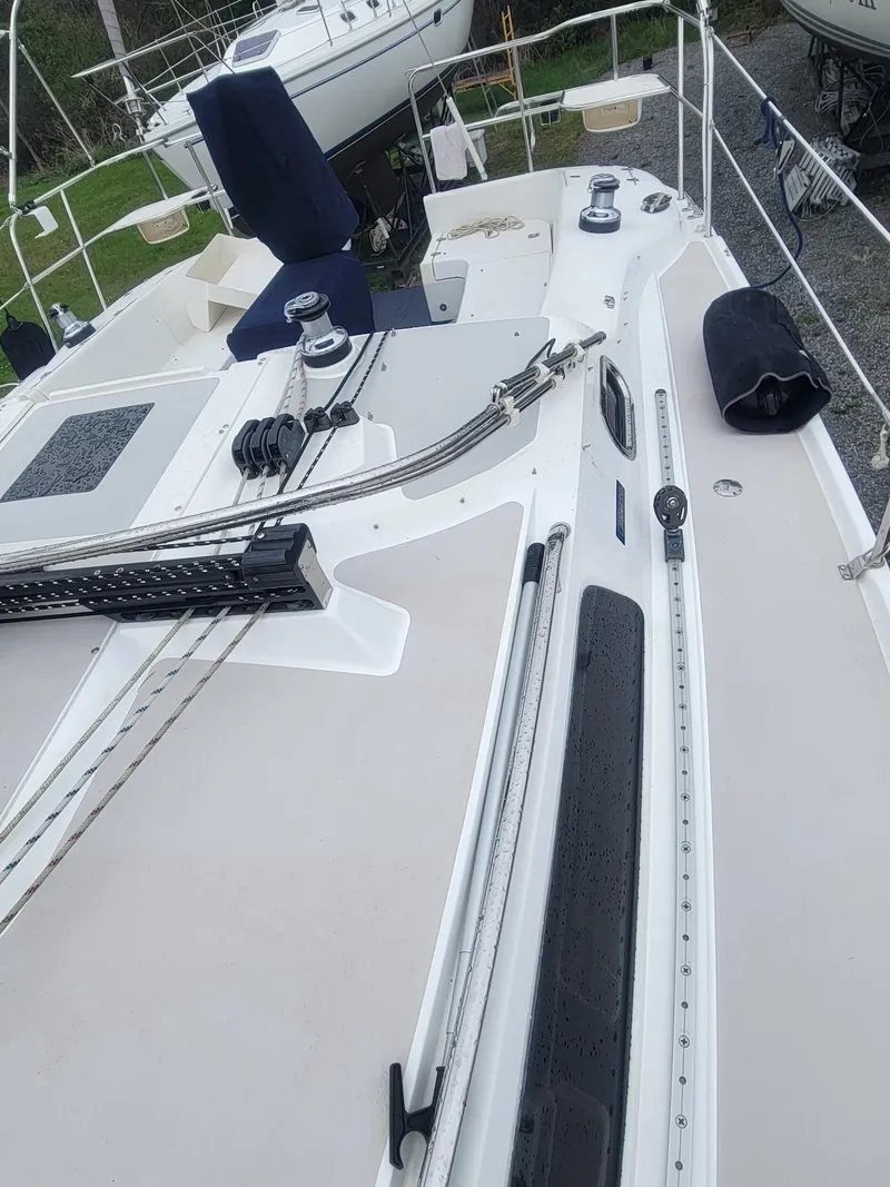 Slide: The Image of 2010 Catalina 350 sailboat deck with rigging and winches. - 20