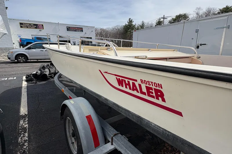 Slide: The Image of 1984 Boston Whaler 170 Super Sport boat on trailer in parking lot. - 5
