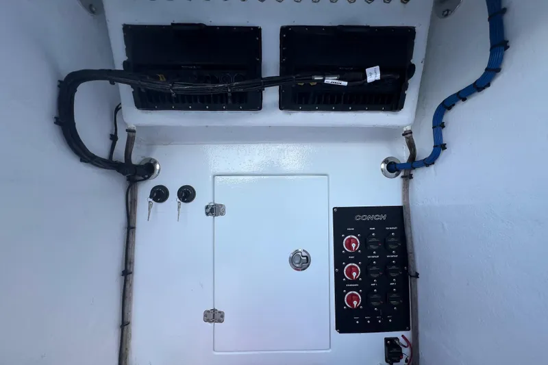 Slide: The Image of Electrical panel and wiring inside a 2017 Conch 30 boat. - 15