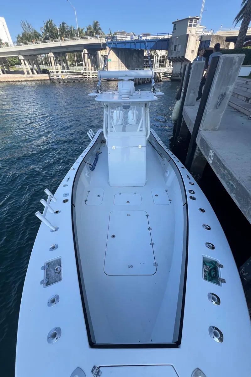 Slide: The Image of 2017 Conch 30 boat docked by a waterfront pier. - 9