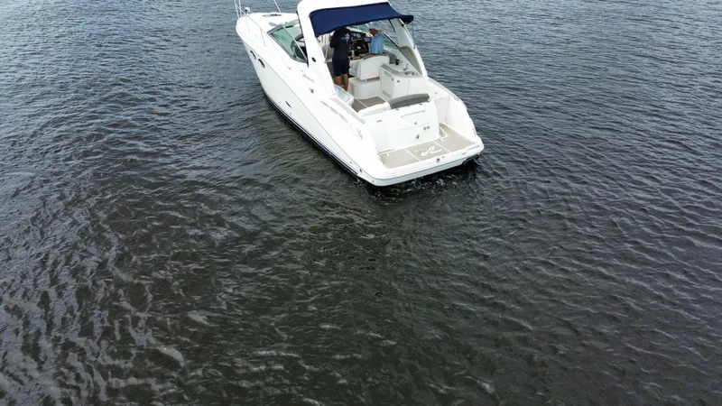 Slide: The Image of 2007 Sea Ray 290 Sundancer cruising on open water. - 2