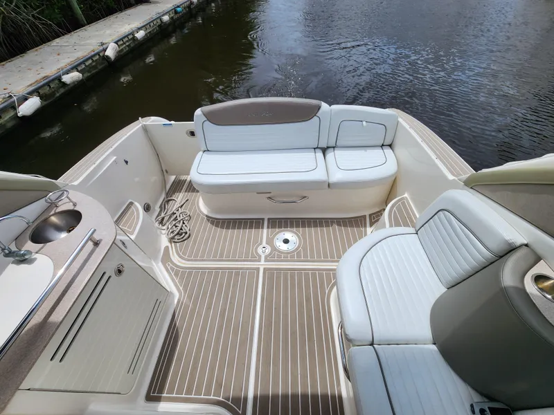 Slide: The Image of 2007 Sea Ray 290 Sundancer boat interior with seating and water view. - 5