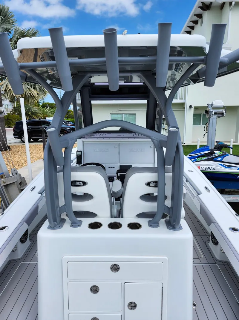 Slide: The Image of 2022 Costa Custom Boats 264 HC, sleek design, spacious deck, rod holders, modern console. - 16