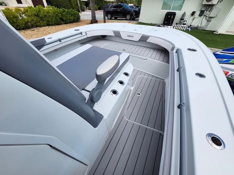 Slide: The Image of 2022 Costa Custom Boats 264 HC interior with sleek seating and modern design. - 5