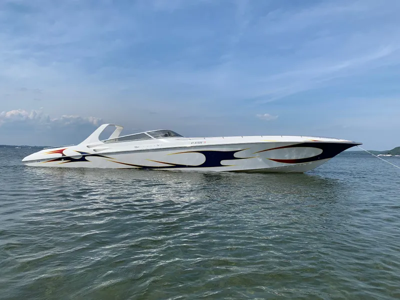 Slide: The Image of 2005 Fountain 47 Lightning speedboat on calm water under clear blue sky. - 0
