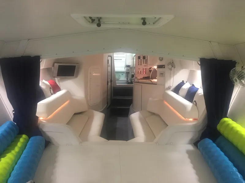 Slide: The Image of Interior of 2005 Fountain 47 Lightning boat with white seating and modern amenities. - 12
