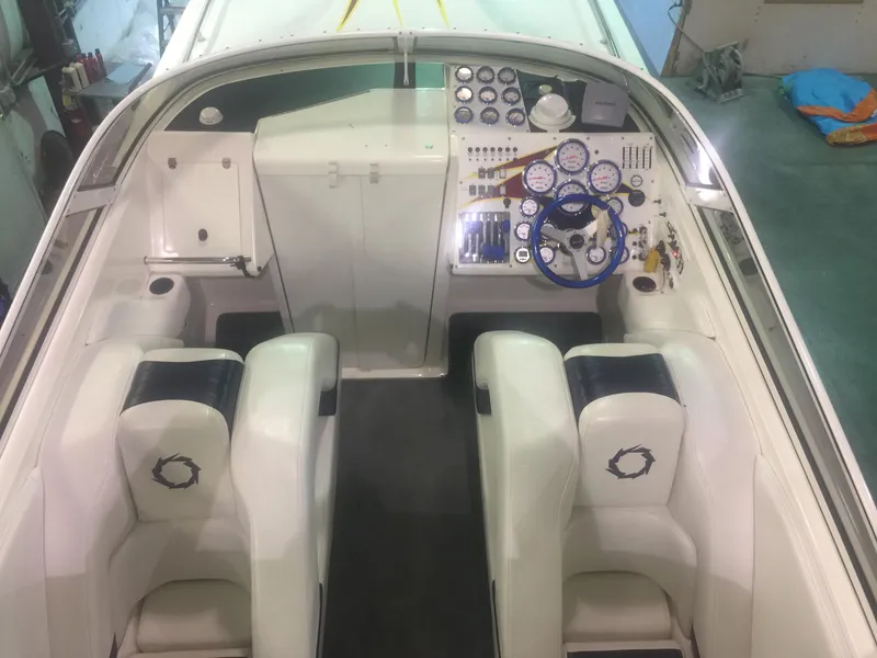 Slide: The Image of 2005 Fountain 47 Lightning boat cockpit with dual seats and detailed control panel. - 6