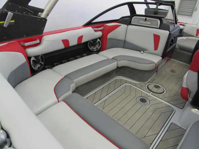 Slide: The Image of 2019 Malibu Wakesetter 20 VTX interior with red and gray seating, modern design. - 5