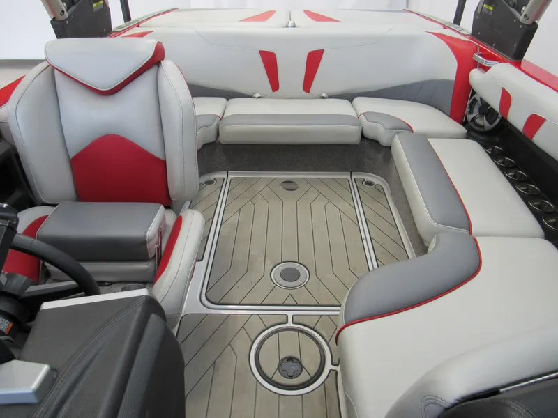 Slide: The Image of 2019 Malibu Wakesetter 20 VTX interior with red and gray seating, stylish design. - 9