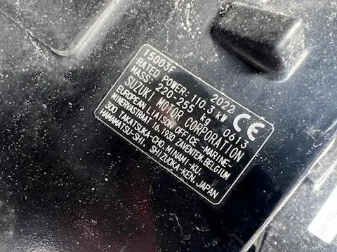 Slide: The Image of Close-up of Suzuki Motor Corporation label on 2001 Seaswirl Striper 2101 Center Console O/B. - 4