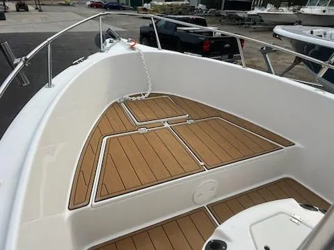 Slide: The Image of 2001 Seaswirl Striper 2101 Center Console boat with teak deck detail. - 5