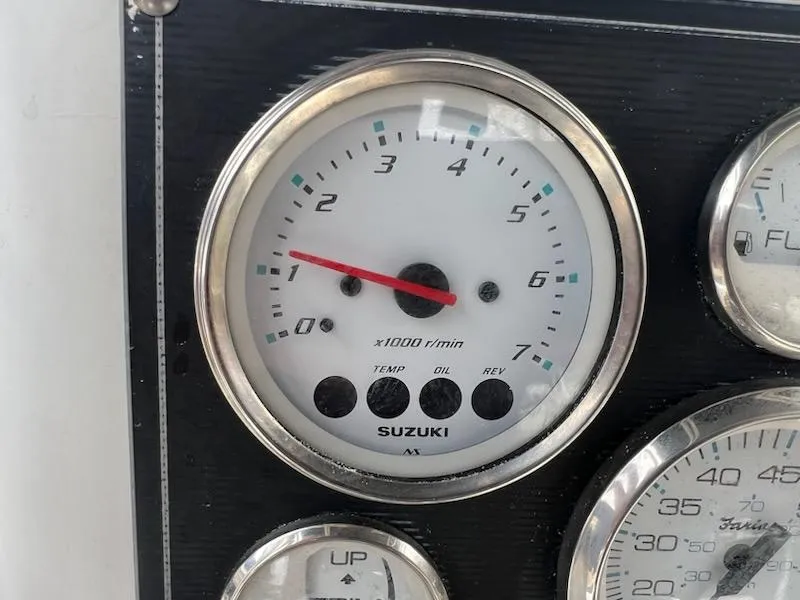 Slide: The Image of Close-up of Suzuki tachometer on 2001 Seaswirl Striper 2101 Center Console boat. - 8