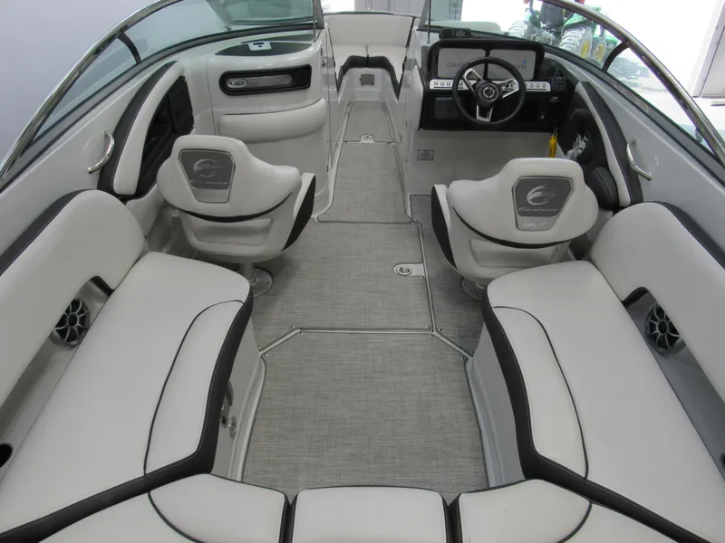 Slide: The Image of 2023 Crownline 270 SS boat interior with modern seating and steering wheel. - 4