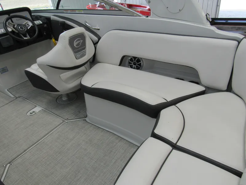 Slide: The Image of 2023 Crownline 270 SS boat interior with plush seating and modern steering console. - 5