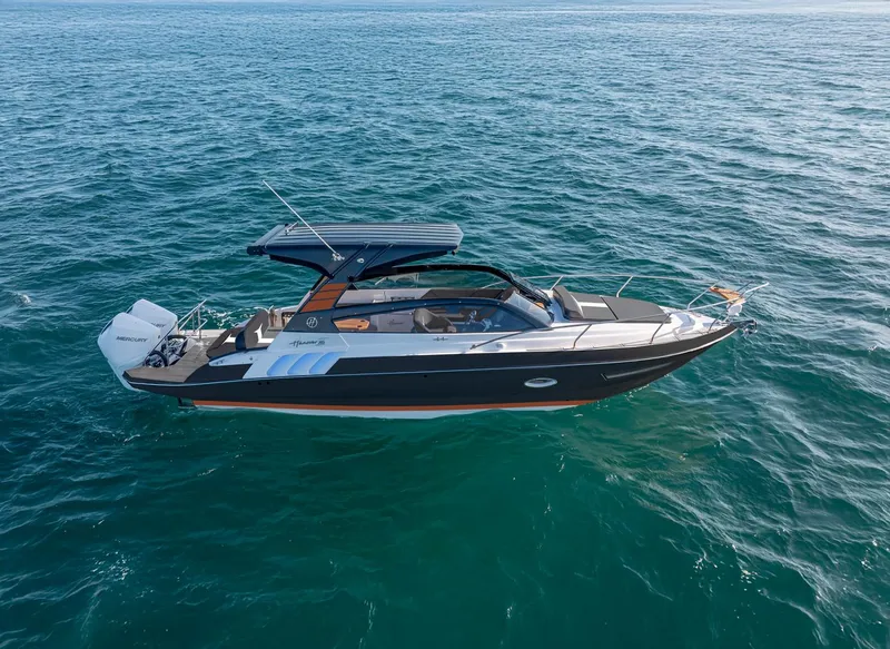Slide: The Image of 2025 Hanover 305 boat cruising on open water, showcasing sleek design and modern features. - 1
