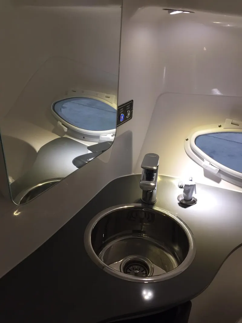 Slide: The Image of Modern Hanover 305 aircraft lavatory sink with mirror, 2025 model, featuring sleek design and lighting. - 7