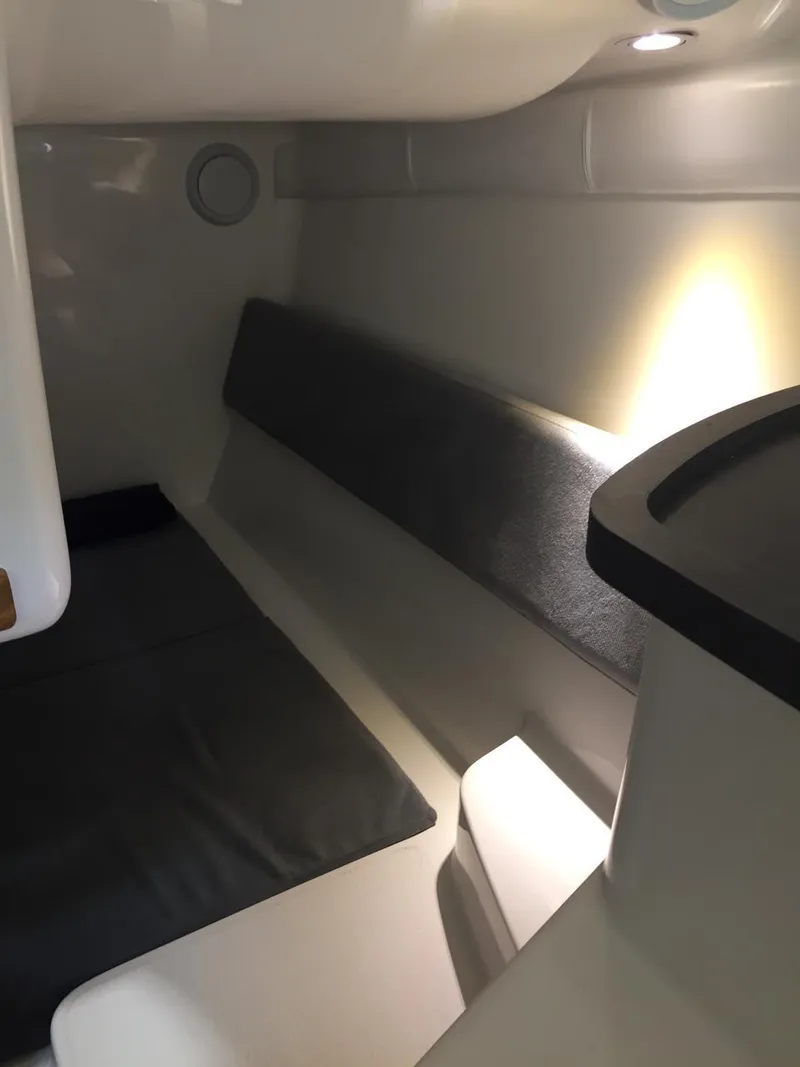 Slide: The Image of 2025 Hanover 305 interior cabin with modern lighting and sleek design. - 8
