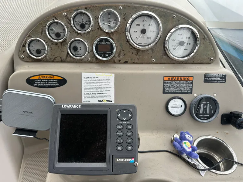 Slide: The Image of 2001 Bayliner 2655 Cierra dashboard with gauges and Lowrance navigation system. - 21