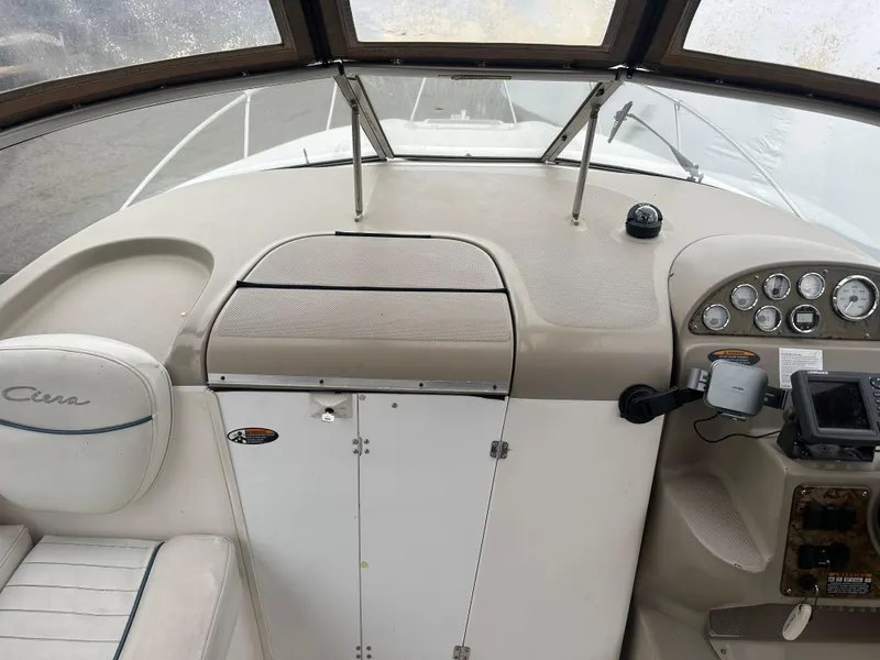Slide: The Image of 2001 Bayliner 2655 Cierra boat cockpit with steering wheel and instrument panel. - 22