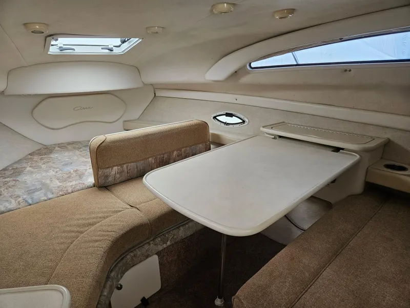 Slide: The Image of Interior of 2001 Bayliner 2655 Cierra boat with seating and table. - 28