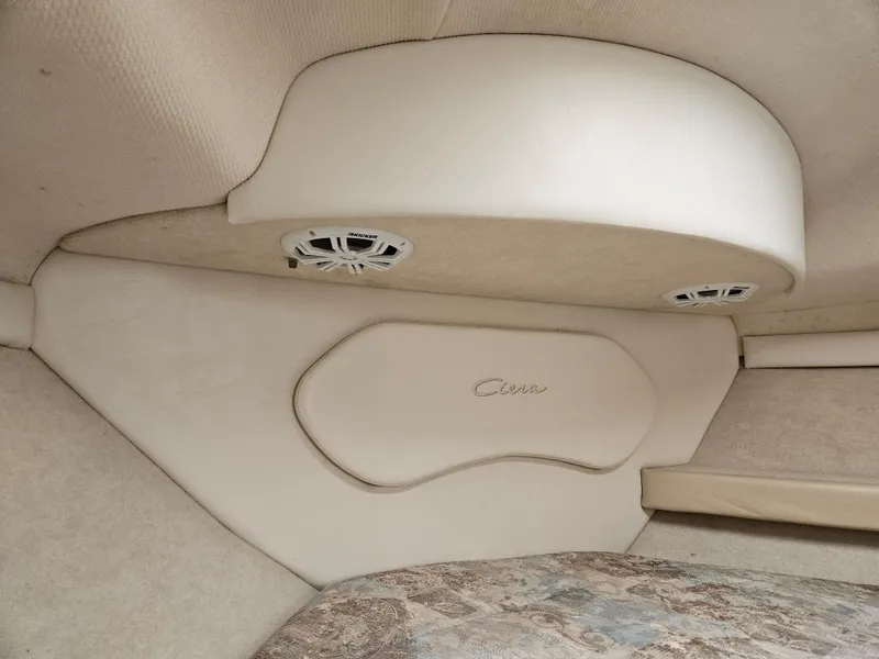 Slide: The Image of 2001 Bayliner 2655 Cierra cabin interior with beige upholstery and built-in speakers. - 30