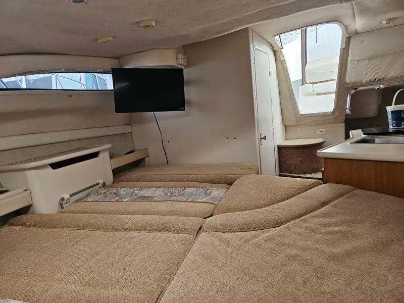 Slide: The Image of Interior of 2001 Bayliner 2655 Cierra boat with cozy seating and mounted TV. - 32