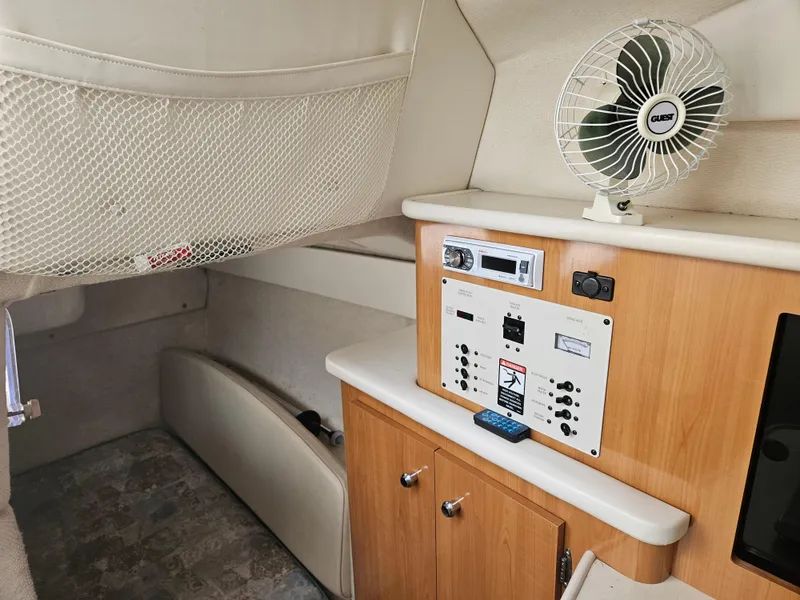 Slide: The Image of 2001 Bayliner 2655 Cierra cabin interior with control panel and fan. - 39