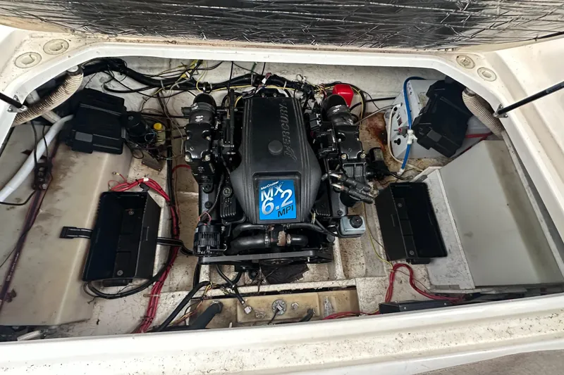 Slide: The Image of Engine compartment of a 2001 Bayliner 2655 Cierra boat, featuring a 6.2L MerCruiser engine. - 42
