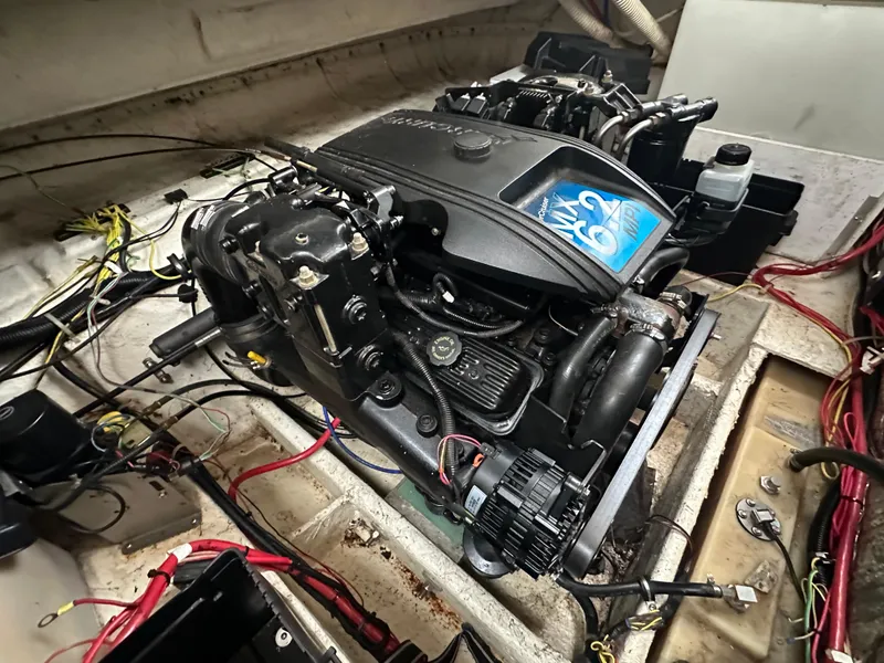 Slide: The Image of Engine compartment of a 2001 Bayliner 2655 Cierra boat, featuring a MerCruiser engine. - 44