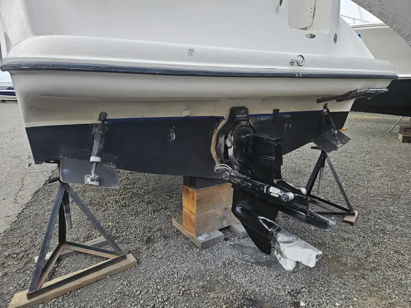 Slide: The Image of 2001 Bayliner 2655 Cierra boat on stands, showing the stern and outdrive. - 45
