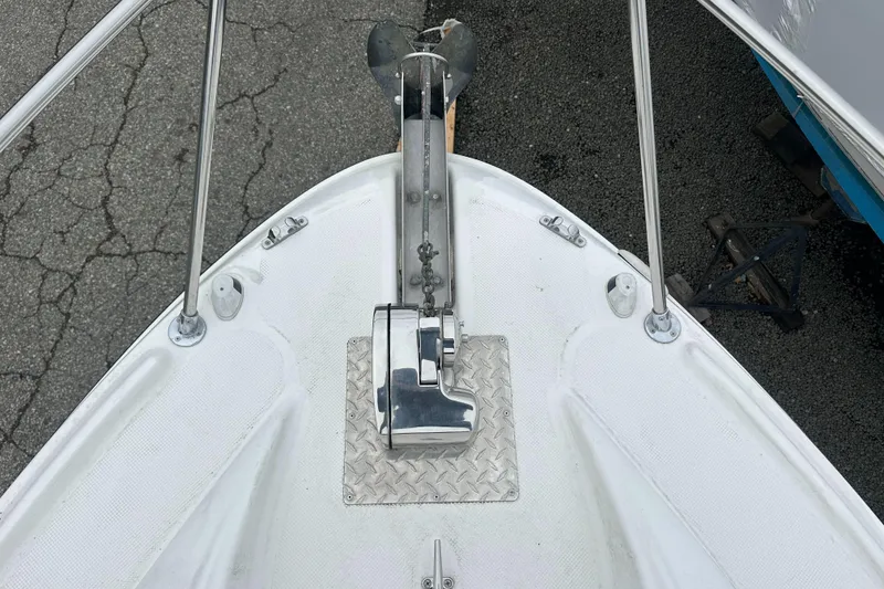 Slide: The Image of 2001 Bayliner 2655 Cierra boat bow with anchor and metal fittings. - 48